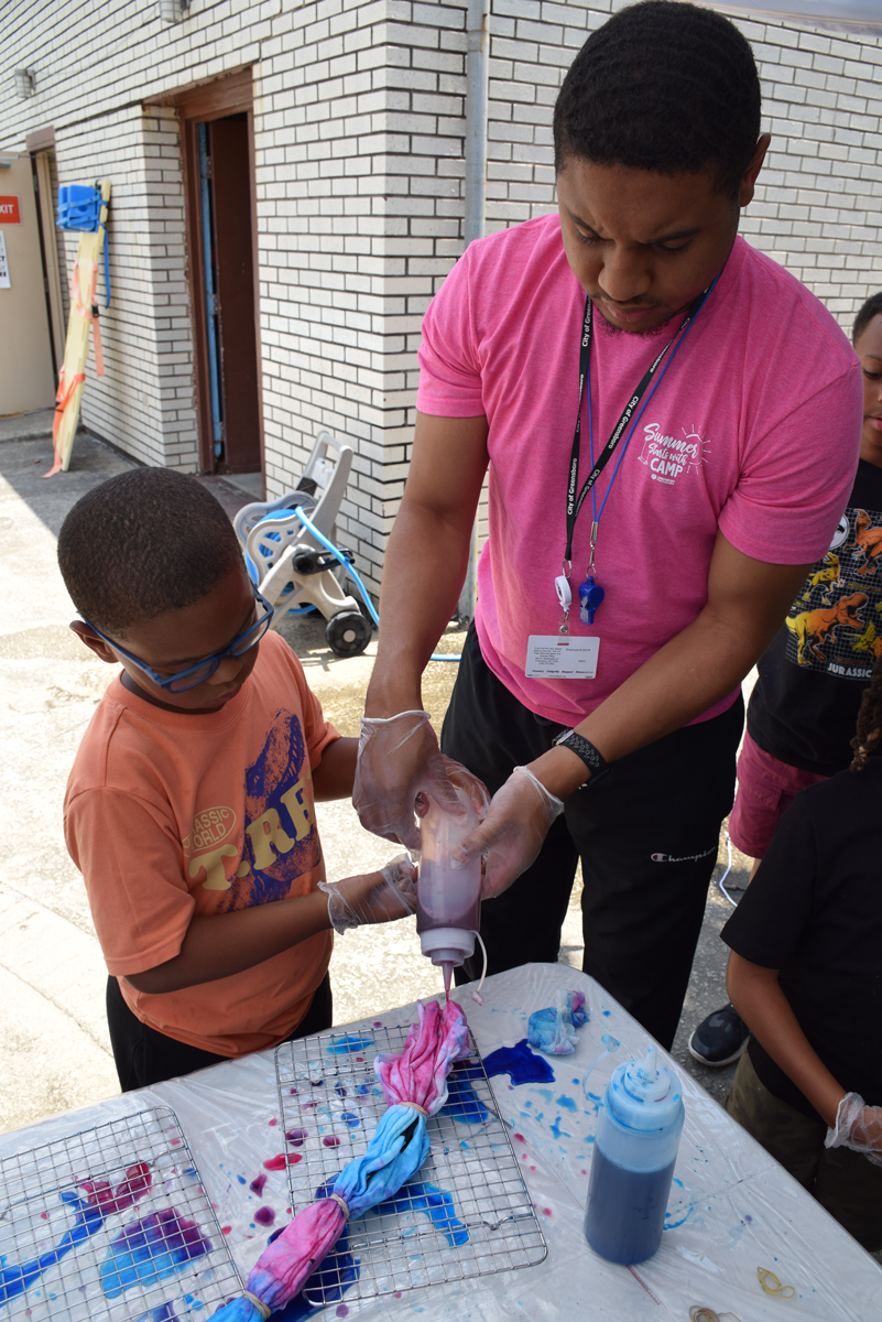 DSC_0037 Man and young boy making a tie-dye t-shirt